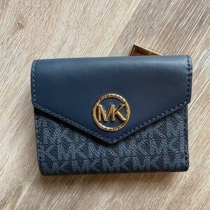 NWT Authentic Michael Kors wallet. Non smoking